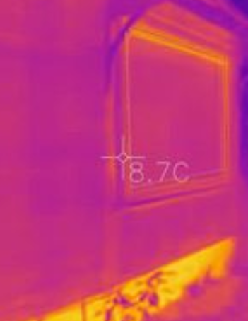 Thermal image showing heat loss from slab-sides during winter, which need to be insulated to improve house heat loss.
