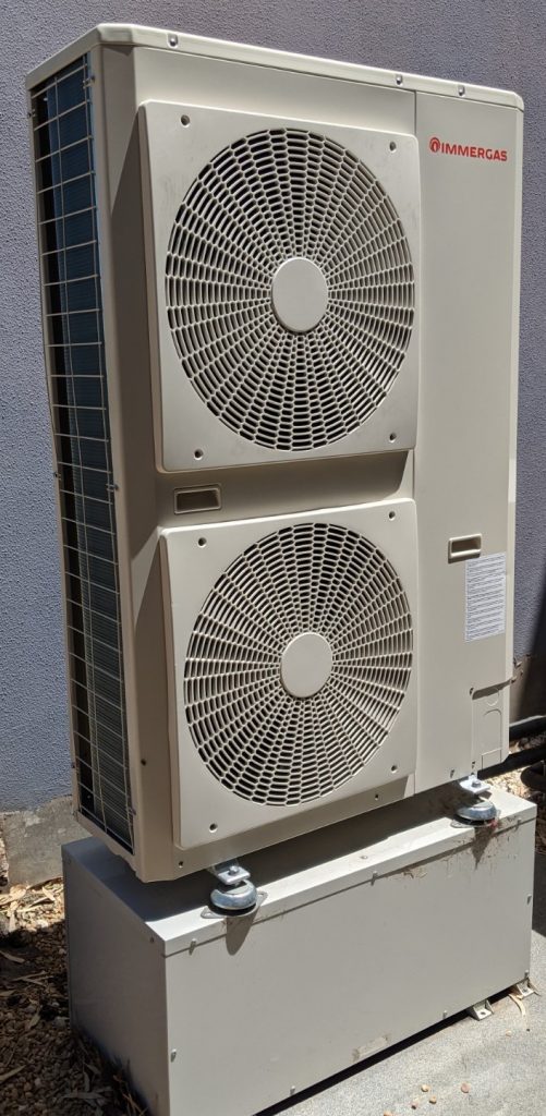 Hydrosol image of Immergas Audax hydronic heat pump mounted on a horizontal buffer tank