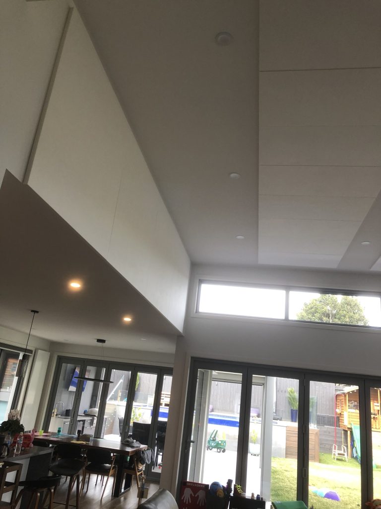 Image of Sontext wall and ceiling baffles reduce sound reverberation of hard floors with large glass area