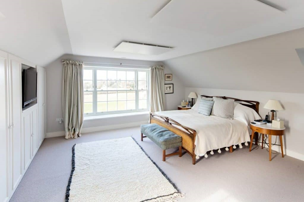 Image of Herschel ceiling-mounted infrared panel heaters in a bedroom